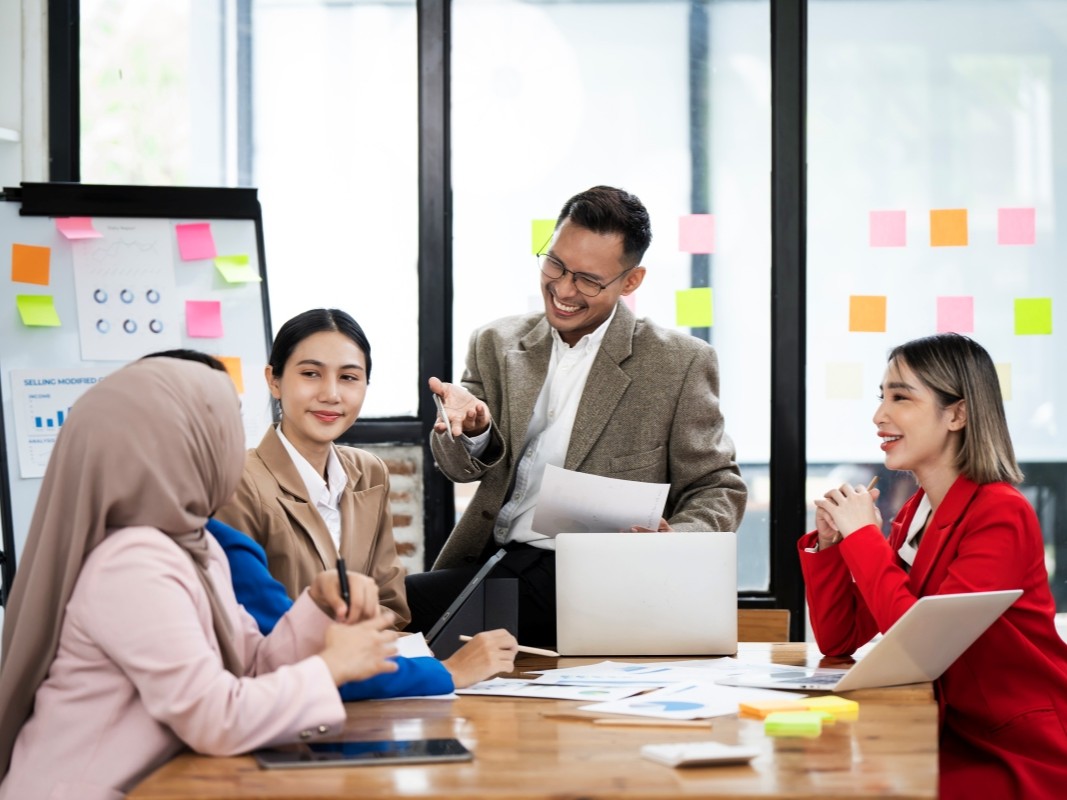 business-people-meeting-office-with-graph-chart-board-collaboration-discussion-financial-report-scaled